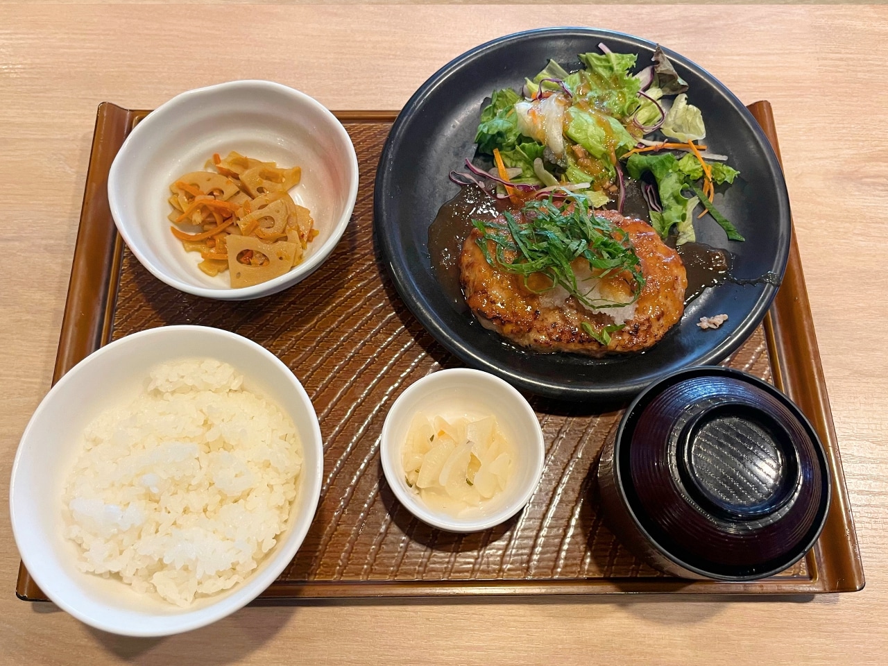 Japanese-style hamburger breakfast set (rice, miso soup, side dish, pickles)