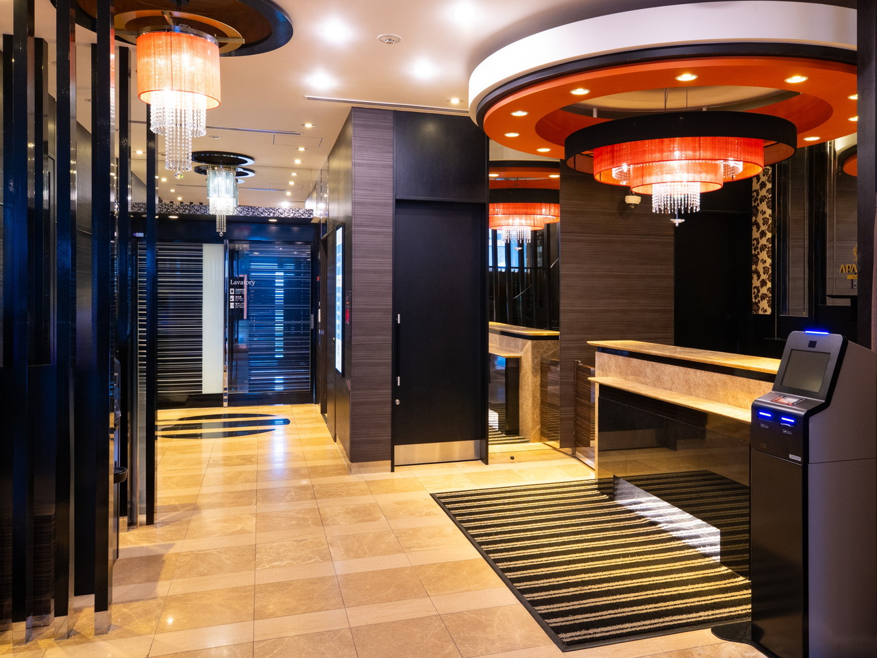 Luxury spacious hotel lobby warmly welcomes you.