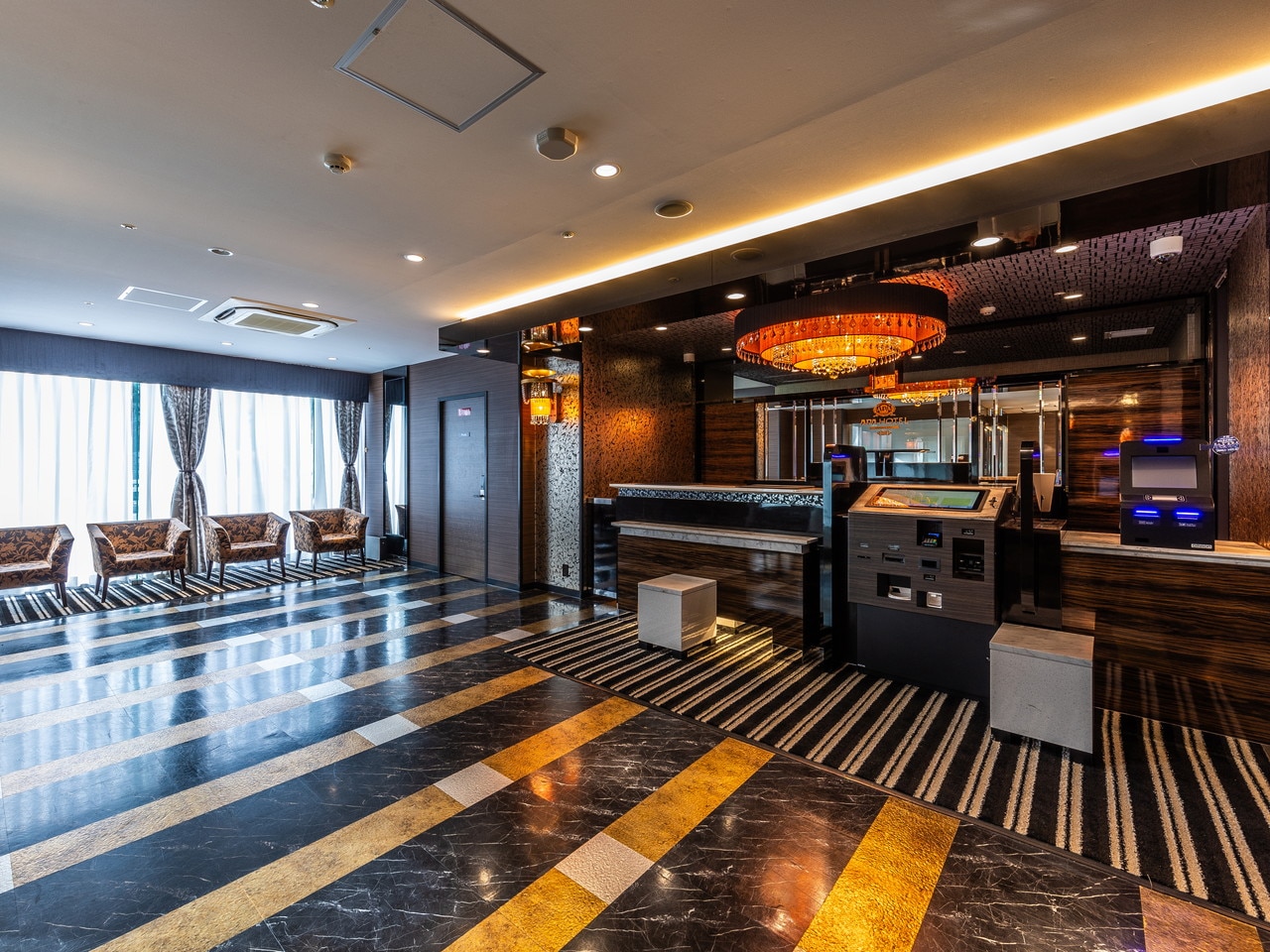 Luxury spacious hotel lobby warmly welcomes you (2 elevators equipped).